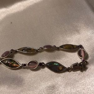 Silver; multicolored; dominant pink; clasp